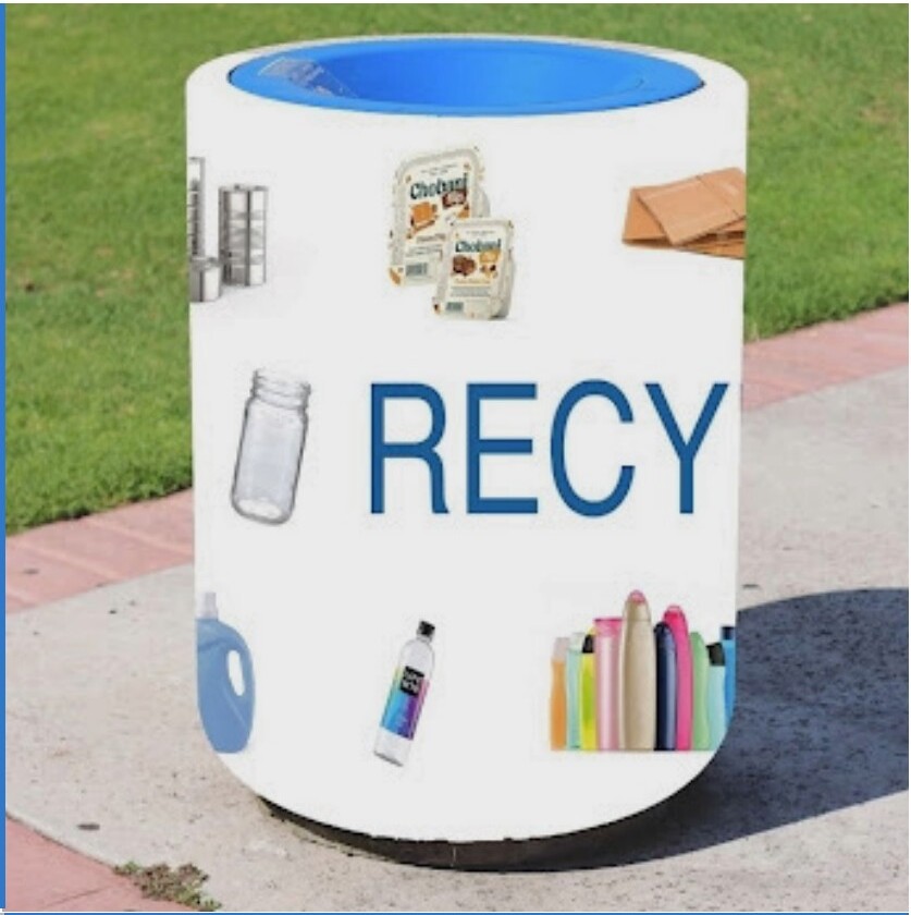 A mid-fidelity dorm bin wrap with a blue lid and printed images of glass jars, plastic bottles, and cardboard.